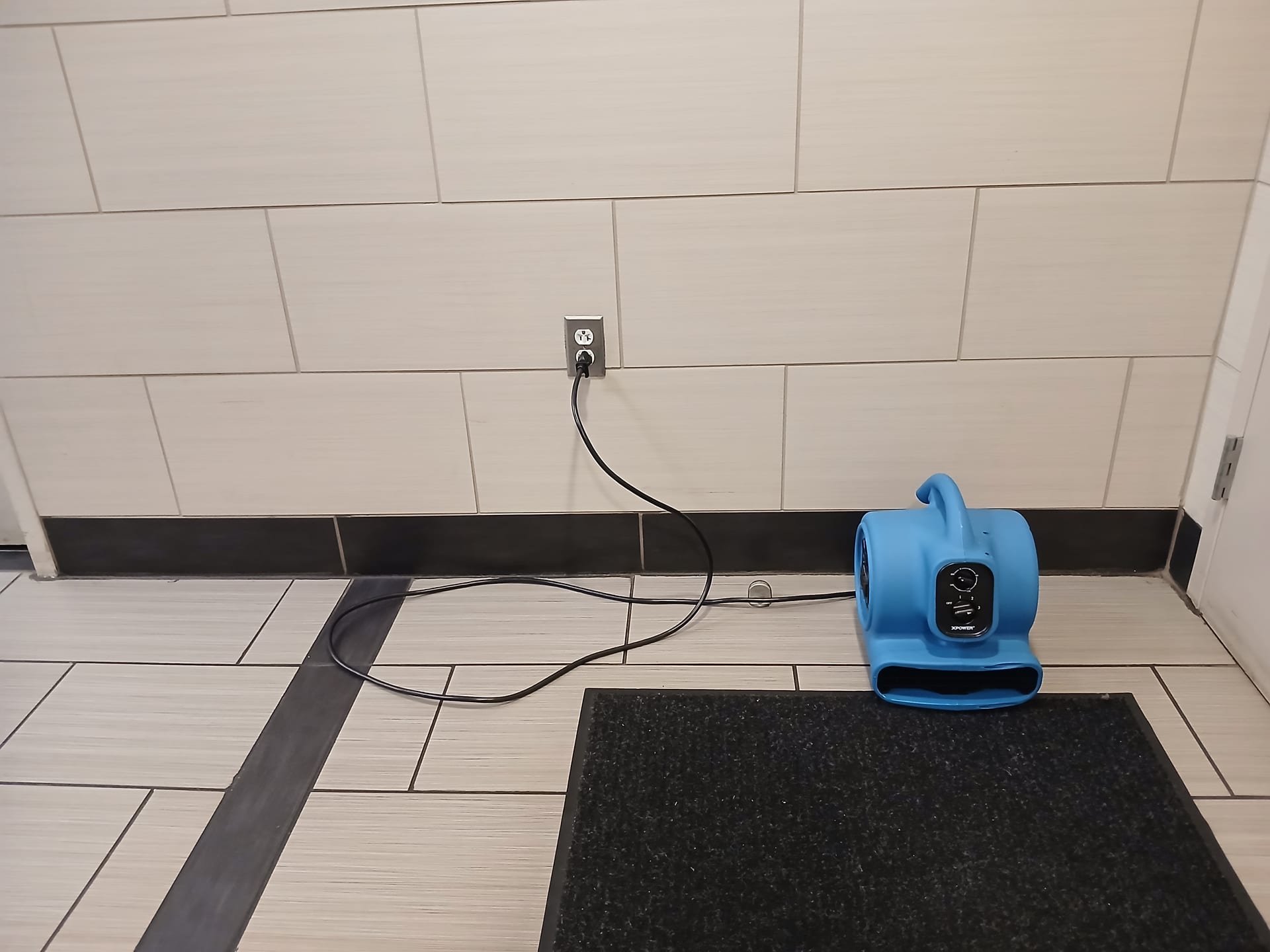Portable air mover operating on an interior floor